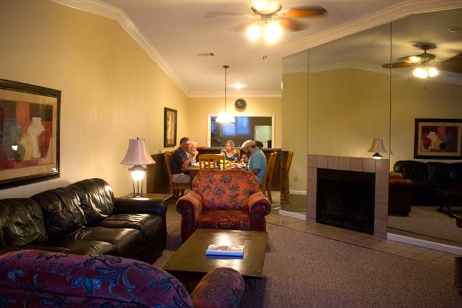 living room with dining room and fireplace