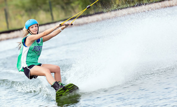 girl wake boarding Lake Hamilton 